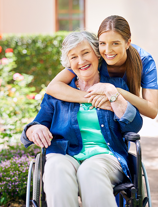 Caregiver with senior woman in a wheelchair